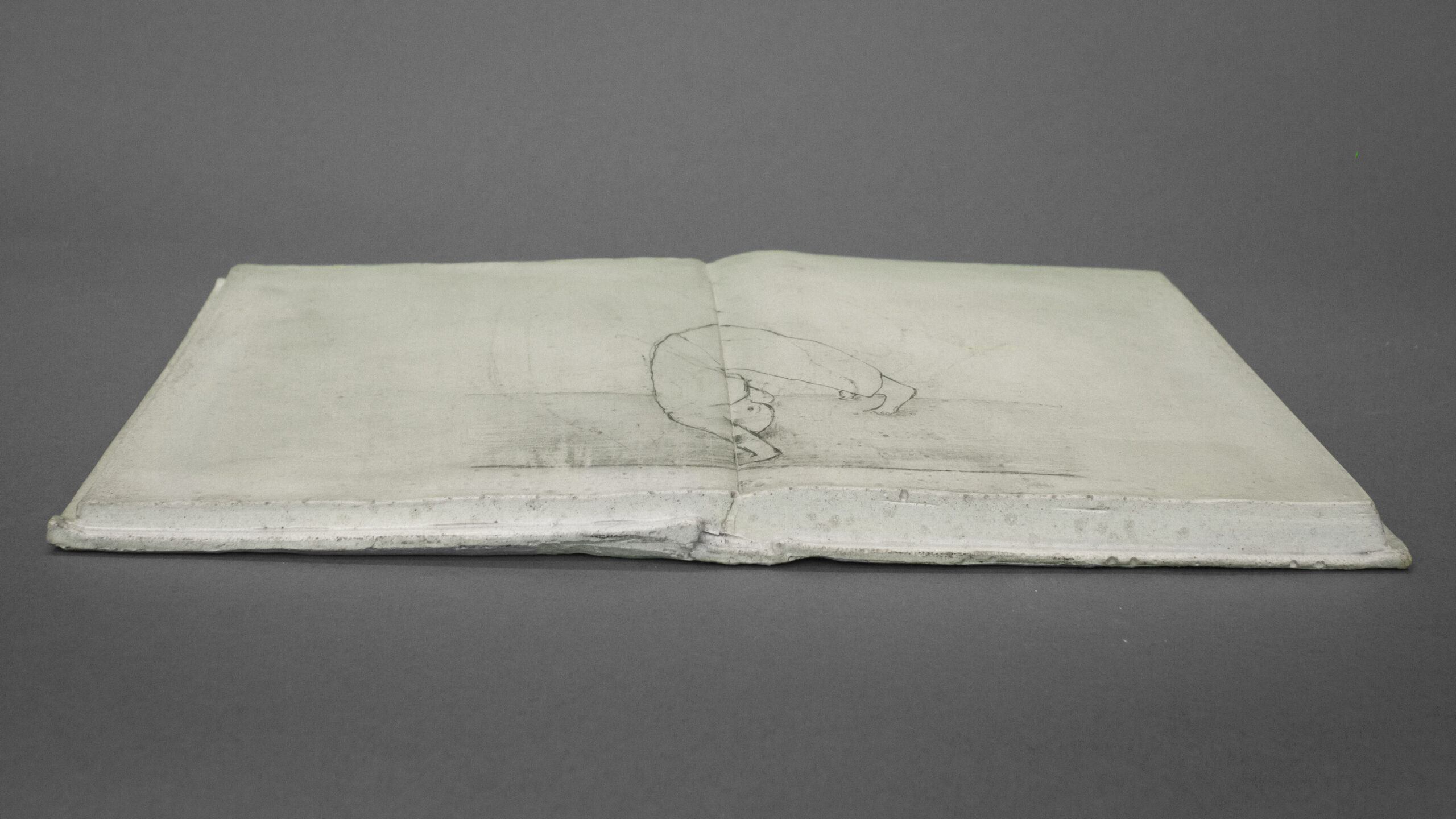 "Somersault" - Book sculpture, JEsmonite and anamorphic pencil drawing by Annika Bergqvist Kupiainen